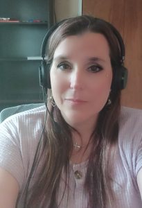 Heather Miller working remotely at her desk, focused on her computer while building her new career after incarceration.