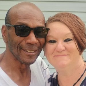 Tabetha Smith smiling with her husband on their wedding day, celebrating love and reconnection after her release from prison.