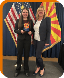 Analiese Alexander receiving the Governor’s Inspired Youth Leadership Award alongside Michelle Cirocco.