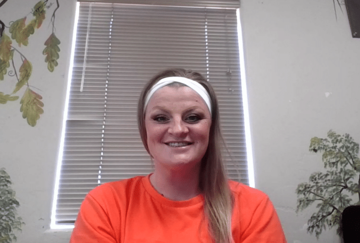 Tiffany, a Televerde Foundation program participant, smiles while preparing her small business plan for a statewide pitch competition.