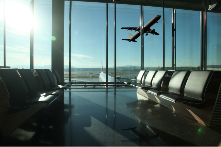 Commercial airplane departing from an airport runway, representing international travel and mobility